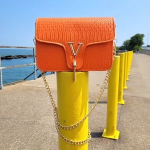 Textured orange shoulder bag